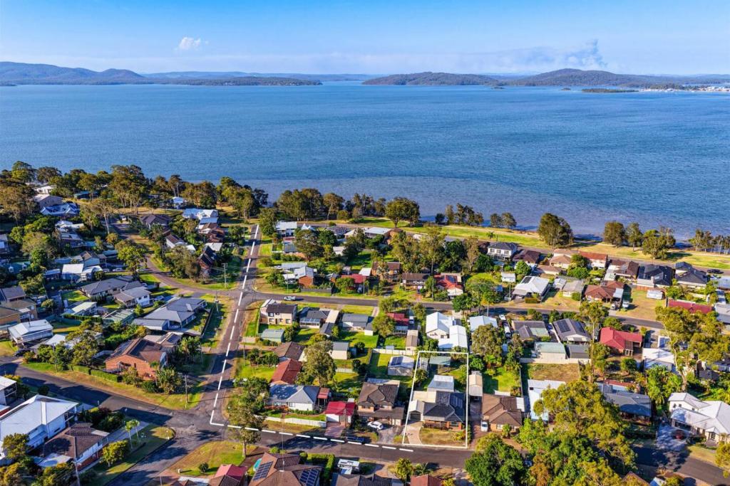 an aerial view of a suburb next to the water at Lemon Tree Getaway Inn in Lemon Tree Passage