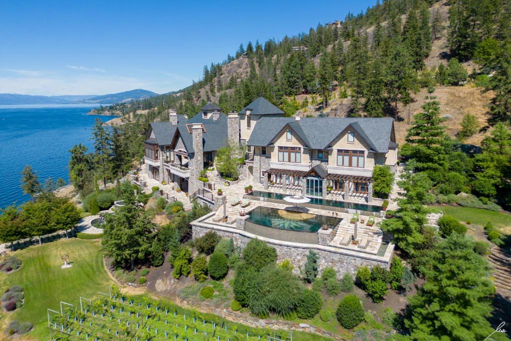 an aerial view of a house on a hill with the ocean at Chateau Okanagan in Kelowna