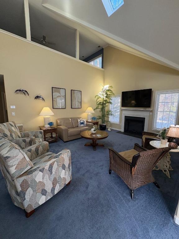 a large living room with couches and a fireplace at Spacious Home Bethany Beach in Frankford