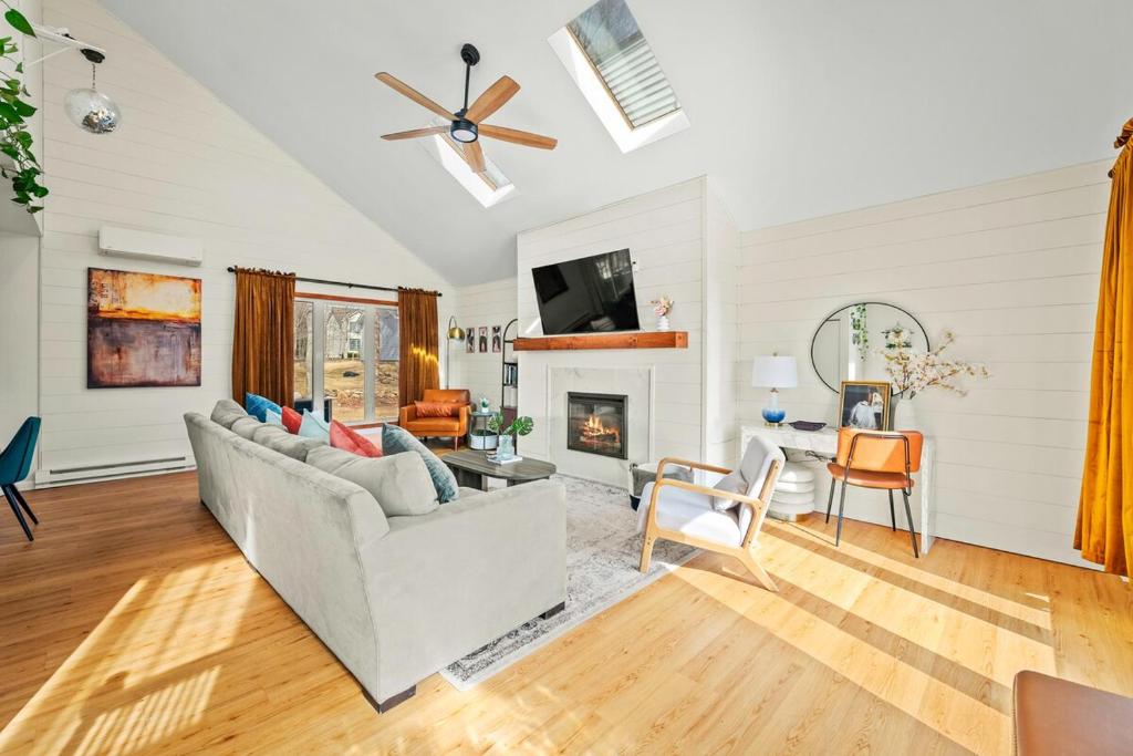 a living room with a couch and a fireplace at Cozy Pocono Retreat in Tobyhanna