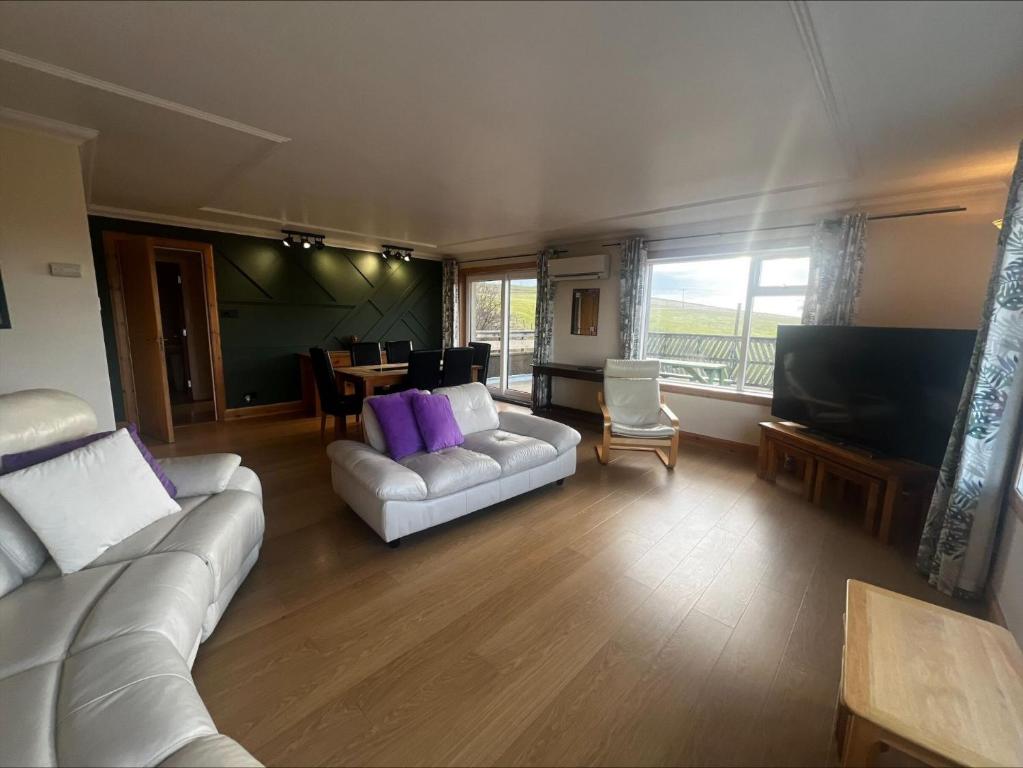 a living room with two white couches and a table at Cunningair, Kirkwall, Orkney - OR00447F in Kirkwall