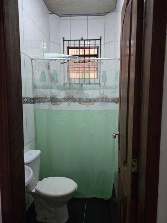 a small bathroom with a toilet and a window at Marahu Lindinhos in Belém