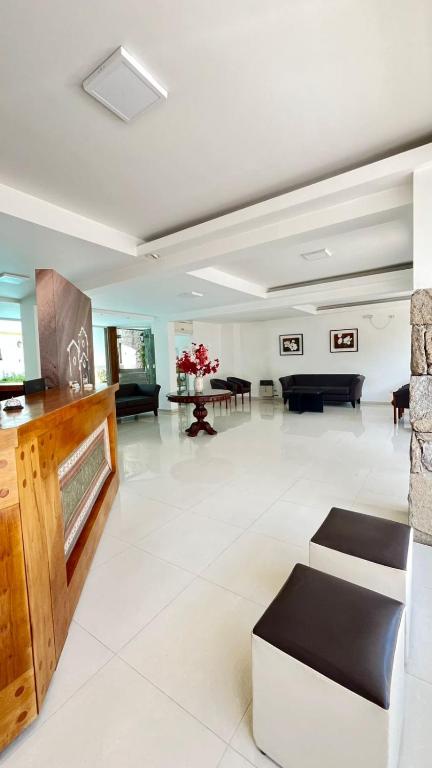 a large living room with a couch and a table at Posada Cerro Hotel in Santa Rosa de Calamuchita