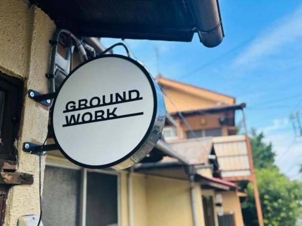 a mirror attached to the side of a building at GROUNDWORK Guesthouse & Lounge in Yugawara