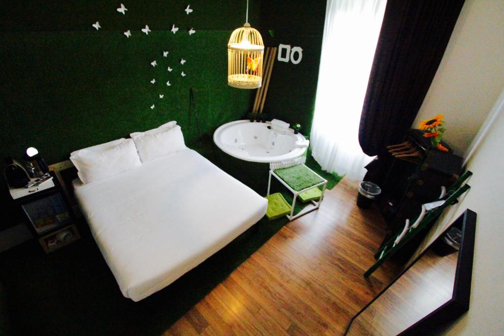 Posteľ alebo postele v izbe v ubytovaní Jacuzzi Rooms