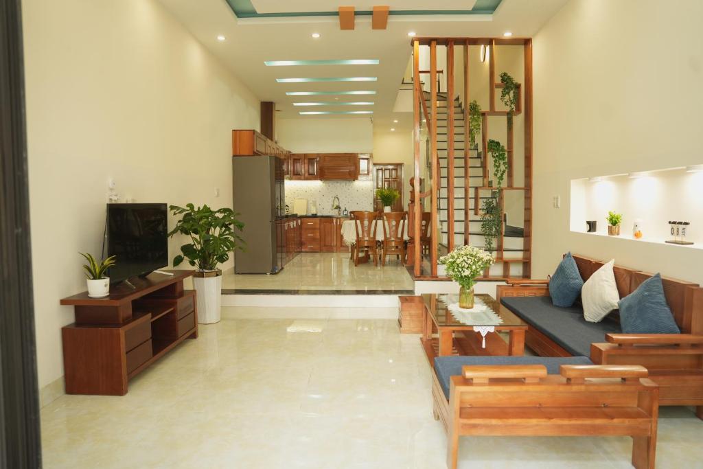 a living room with a couch and a table at Jasmine Homestay in Danang