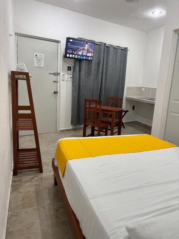 Hotel AF 7 tesisinde bir odada yatak veya yataklar