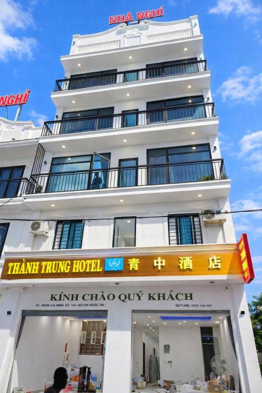 a white building with a sign in front of it at Thành Trung Hotel Nghệ An in Vinh