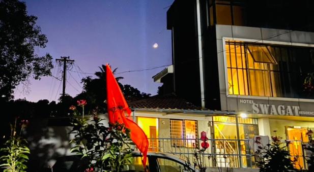 a red flag in front of a building at Hotel Swagat Residency in Panhāla