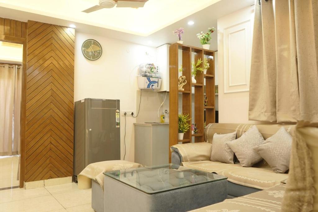 a living room with a couch and a table at kailash keep in Haridwār