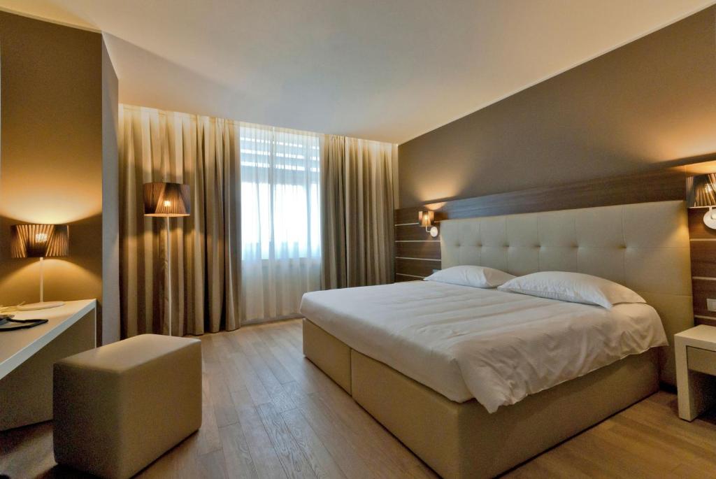 Postel nebo postele na pokoji v ubytování Hotel Glamour