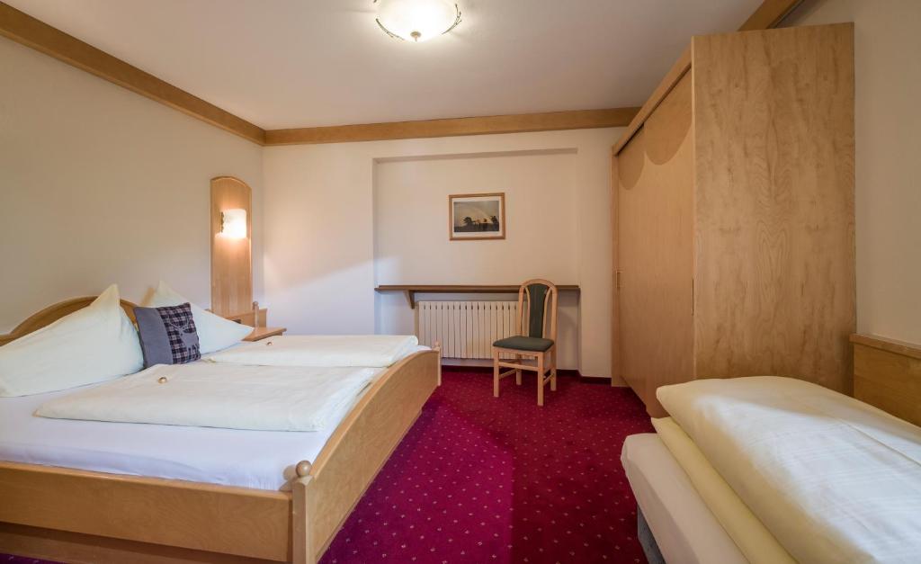 Postel nebo postele na pokoji v ubytování Appartements Rofan