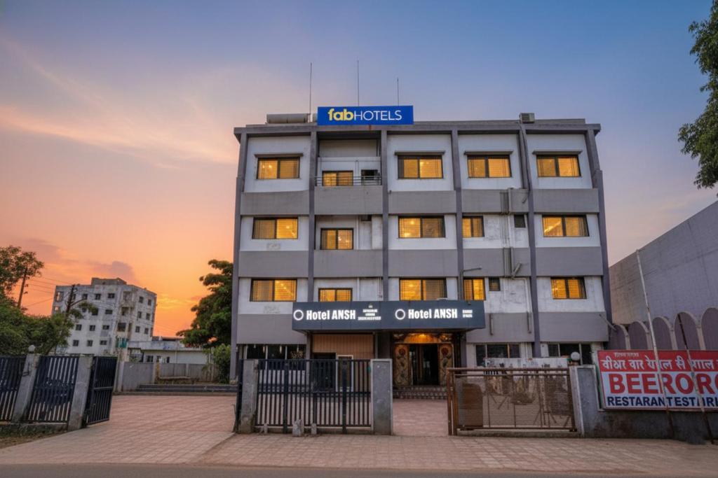 a building with a sign on top of it at FabHotel Ansh in Aurangabad