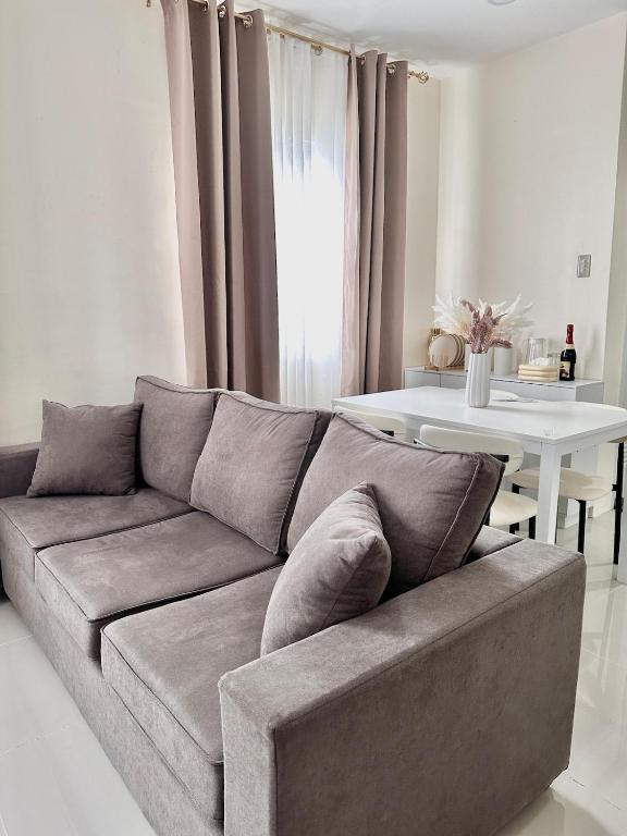 a living room with a couch and a table at Casa Solara in General Santos