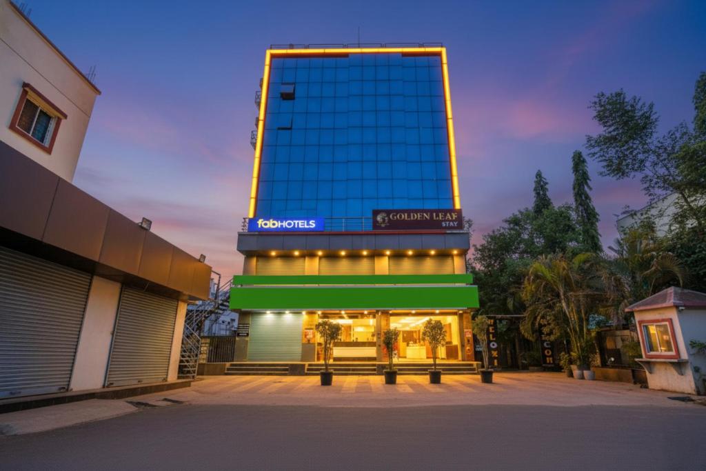 a building with a sign on top of it at FabHotel Golden Heights in Hinjewadi