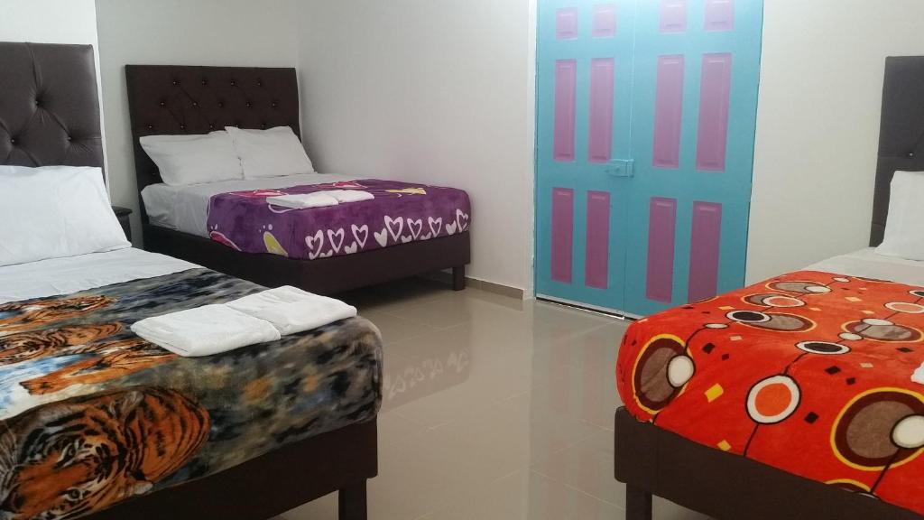 Postel nebo postele na pokoji v ubytování Hostal Johnnier Macao Punta Cana
