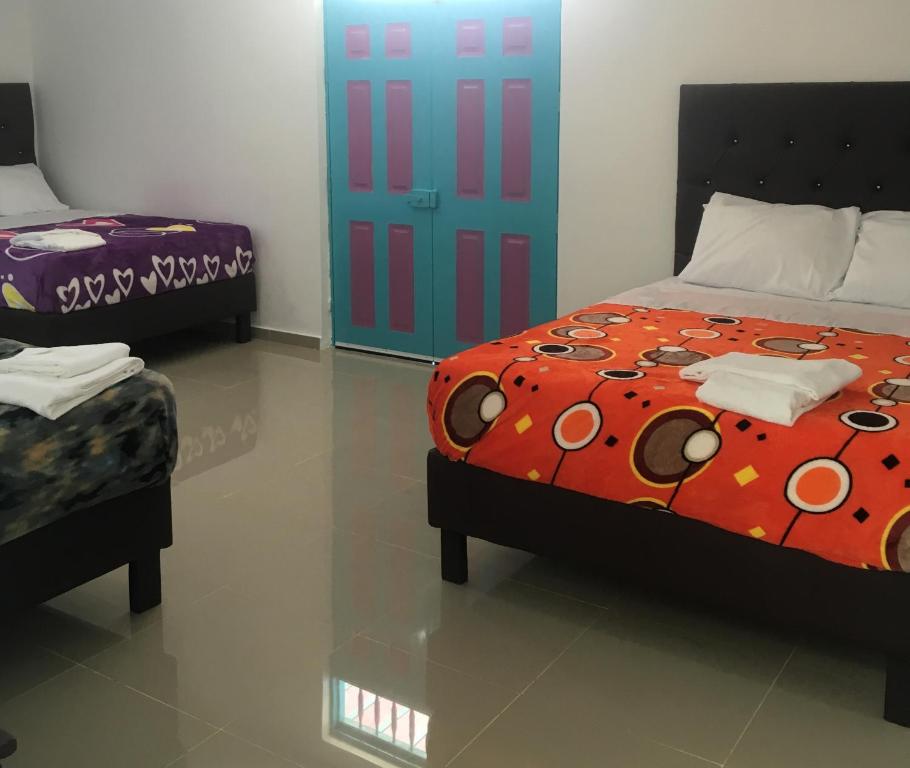 Postel nebo postele na pokoji v ubytování Hostal Johnnier Macao Punta Cana