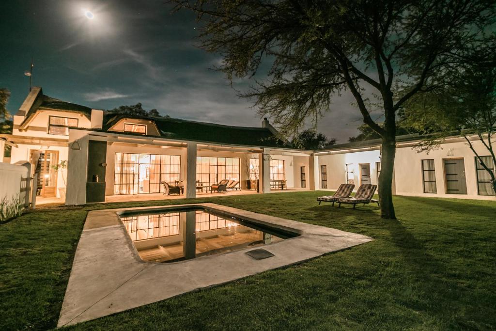 a house with a swimming pool in the yard at The Whyte House in Graaff-Reinet