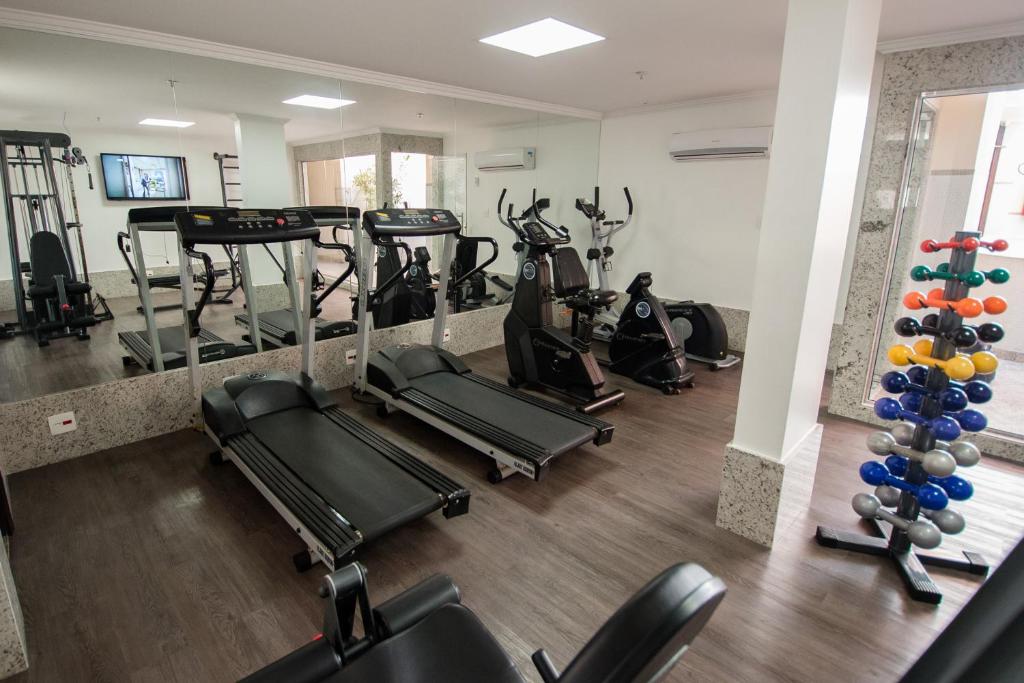 a gym with several treadmills and exercise bikes at Hotel OK in Rio de Janeiro