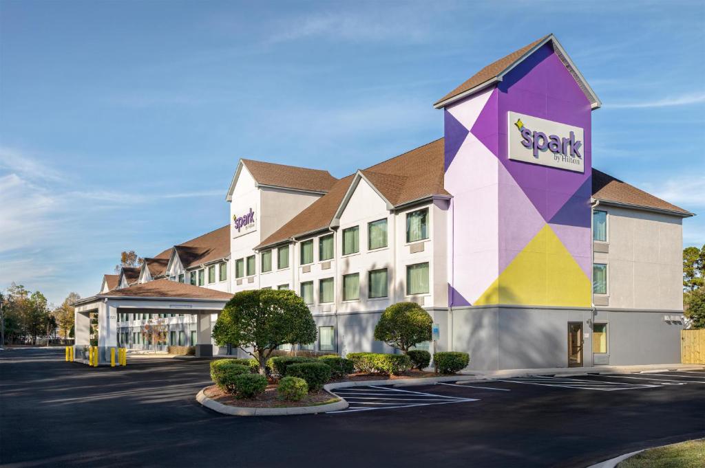 a rendering of a hotel in a parking lot at Spark By Hilton Wilmington in Wilmington