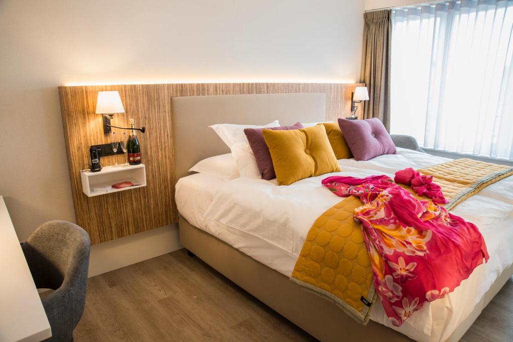 Postel nebo postele na pokoji v ubytování ABC Hotel
