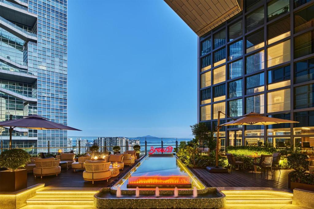 a pool on the roof of a building at Doubletree By Hilton Shenzhen Bay in Shenzhen