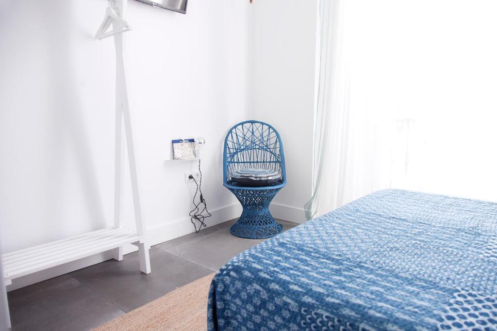 Posteľ alebo postele v izbe v ubytovaní Hostal La Casa Sanlúcar