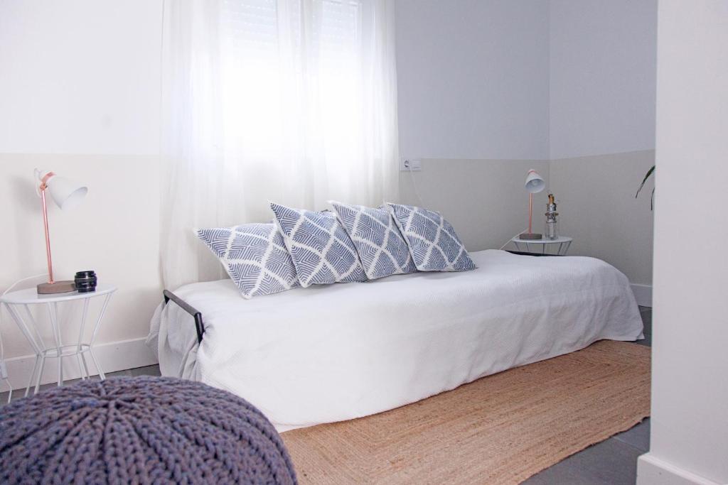 Posteľ alebo postele v izbe v ubytovaní Hostal La Casa Sanlúcar