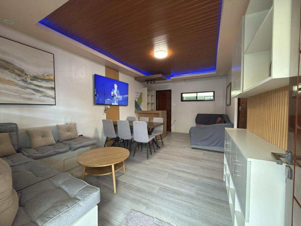 a living room with a couch and a table at Davon- Doña Soledad in Polon