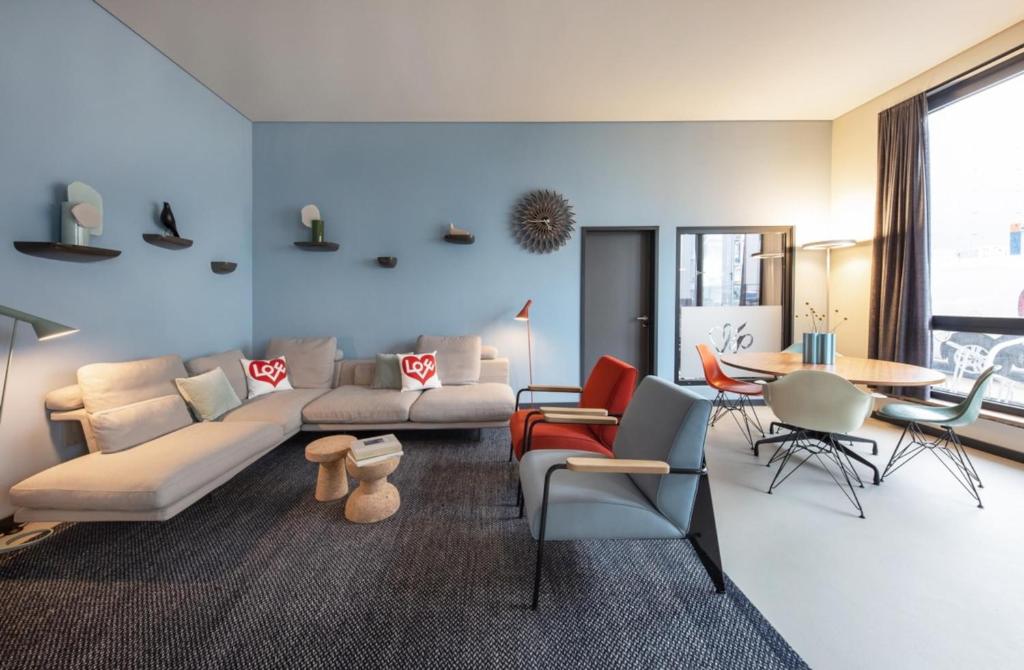 a living room with a couch and a table at ipartment Braunschweig HOME by Best Western in Braunschweig