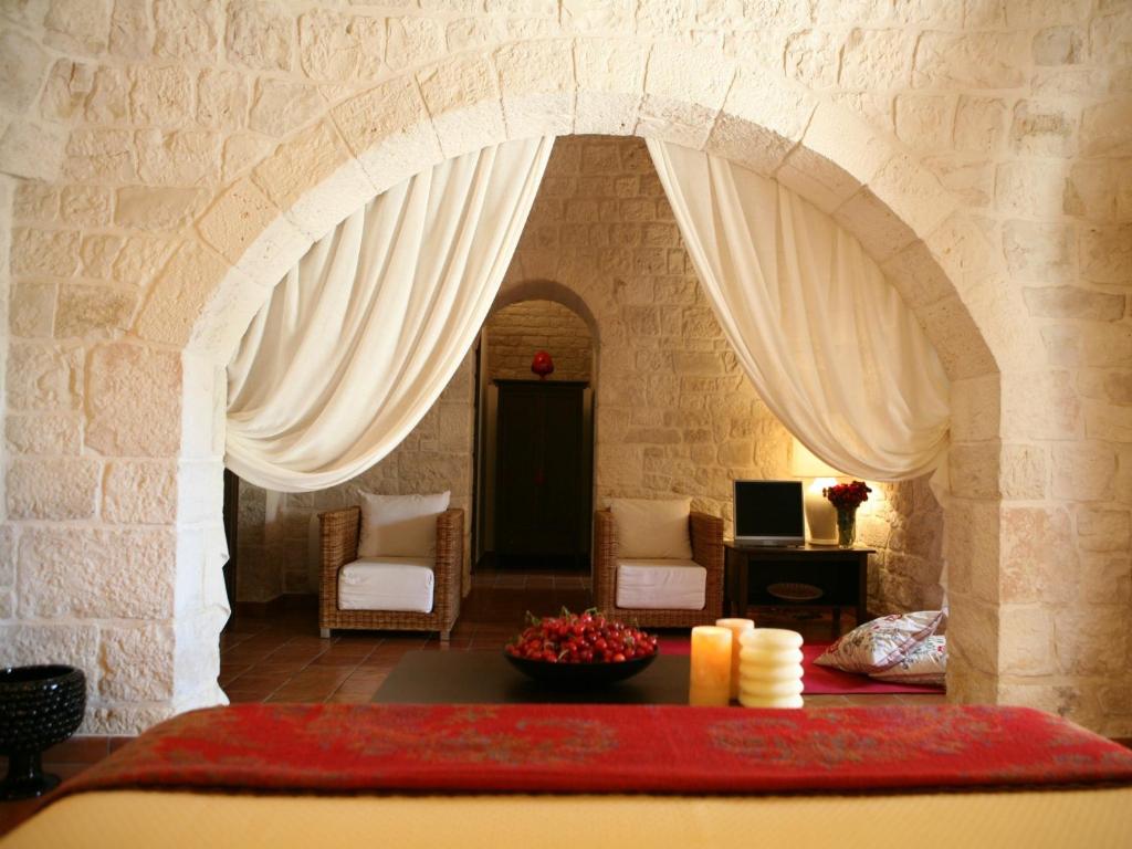 Postel nebo postele na pokoji v ubytování Abate Masseria & Resort