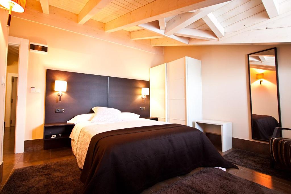 Cama o camas de una habitación en Hotel Restaurante Puente Romano