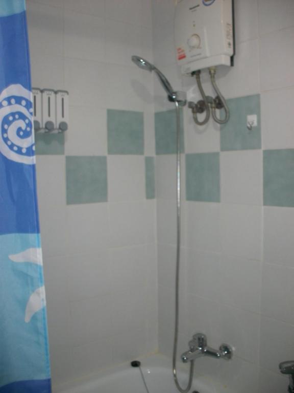 a shower in a bathroom with a toilet and a camera at Hua Hin Condo F - Maysa & Hin Nam in Hua Hin