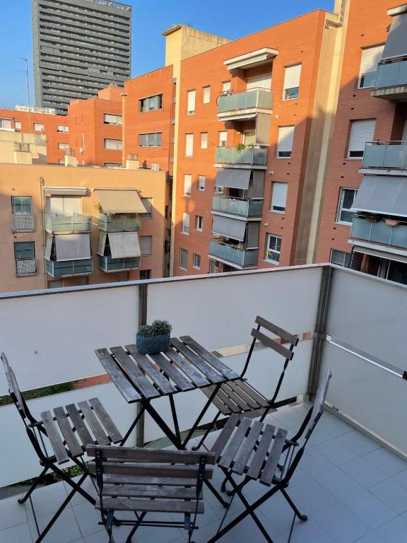 two chairs and a table on a balcony at NEW! Amazing 2 bedroom apartment in Rambla del Poblenou in Barcelona