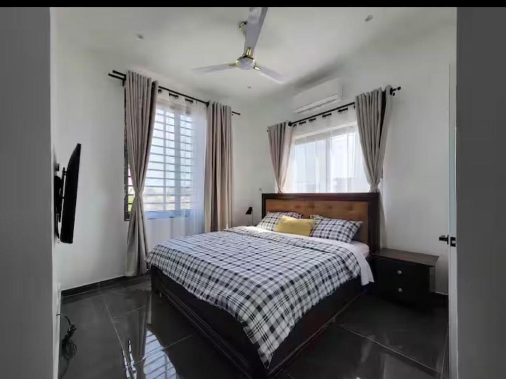 Llit o llits en una habitació de Mya Apartment