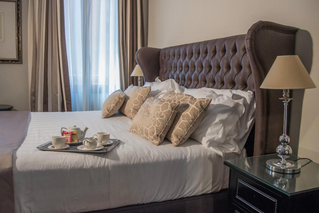 Postel nebo postele na pokoji v ubytování Hotel Monte Cenci