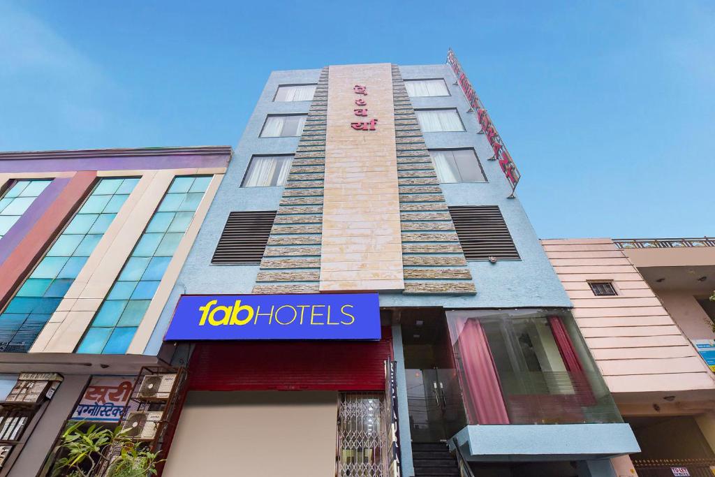 a building with a sign that reads job hotels at FabHotel Aishwarya in Kota