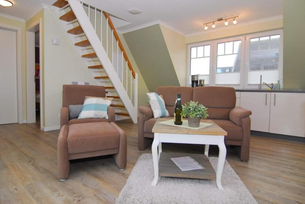 a living room with a couch and a coffee table at Wodan, Whg 2 in Tinnum