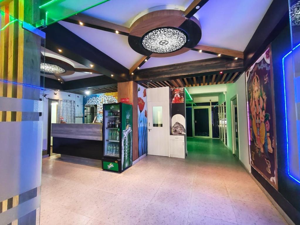 a room with colorful walls and a ceiling at Hotel Sintle Palace in Bhubaneshwar