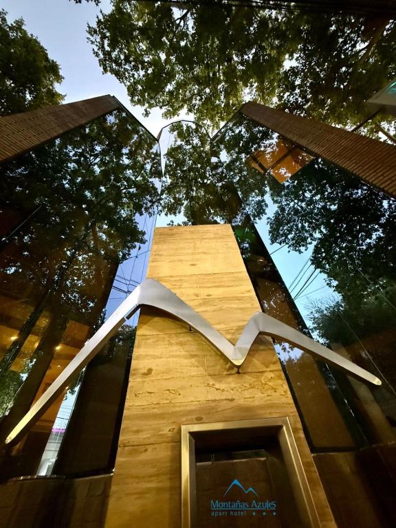 a sculpture on the side of a building at Montañas Azules Apart Hotel in Mendoza