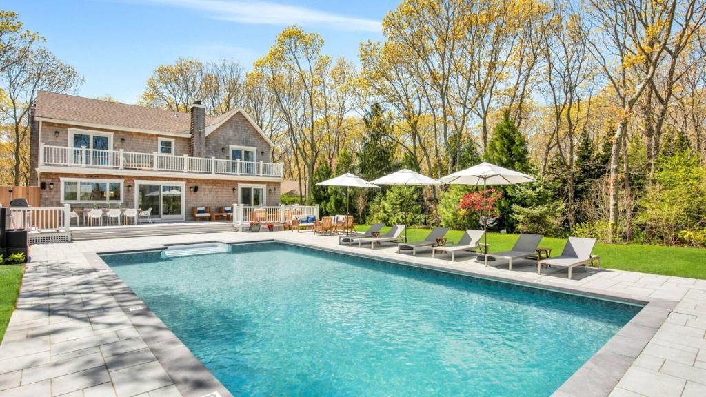 a swimming pool in the backyard of a home at Villa Saltwater Haven in East Hampton