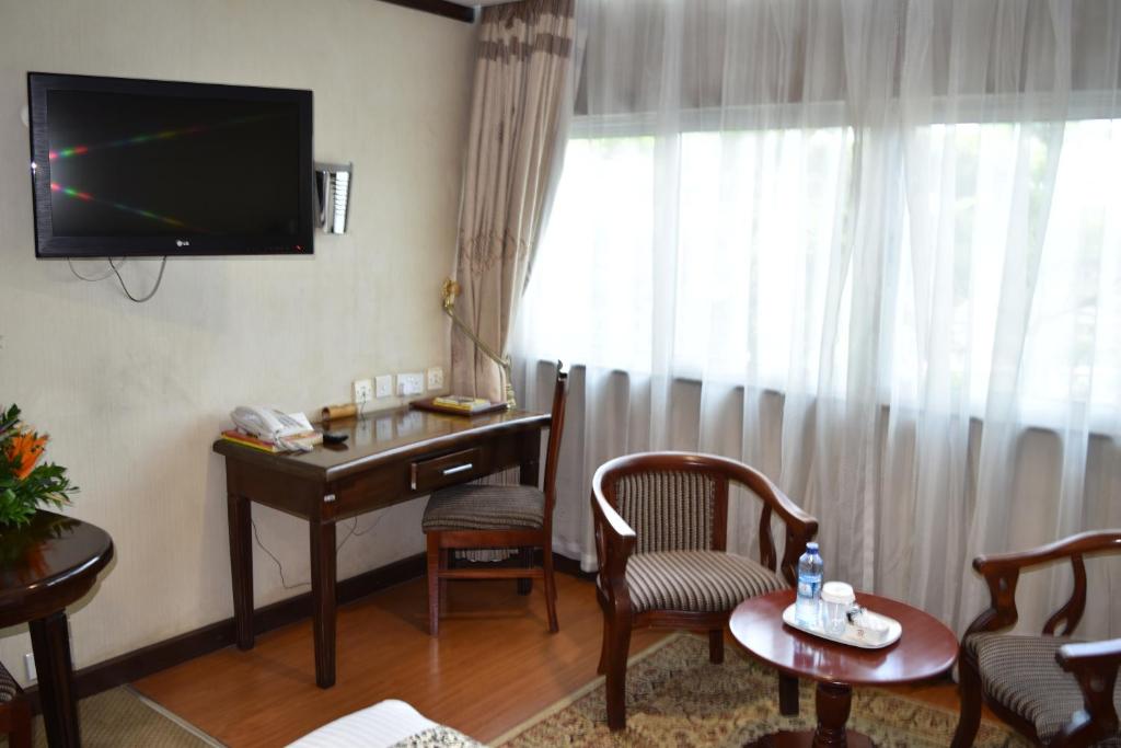 TV a/nebo společenská místnost v ubytování Utalii Hotel