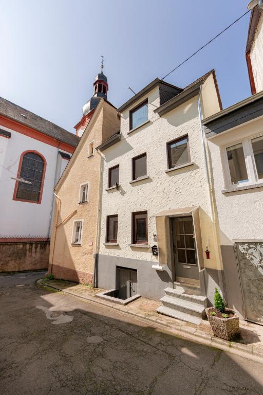 a large white building with a lighthouse on top at Mosel-Refugium Nr 5 in Zell an der Mosel