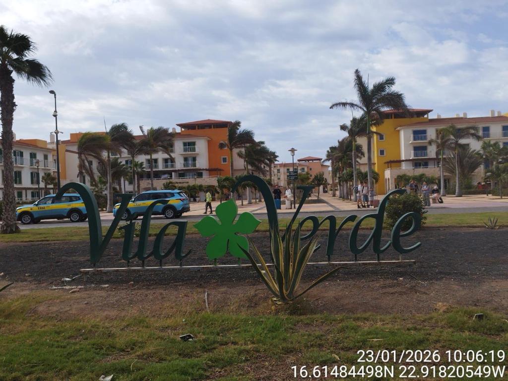 a sign that says paradise with a clover on it at Mb HOUSE VILA VERDE RESORT in Prainha