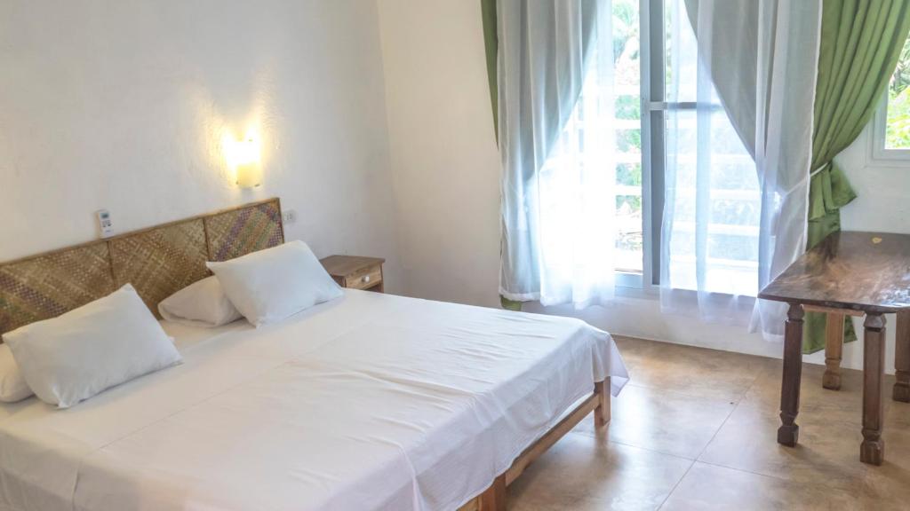 Postel nebo postele na pokoji v ubytování Lanterna Hotel Boracay