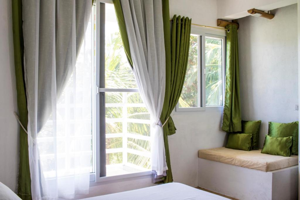 Postel nebo postele na pokoji v ubytování Lanterna Hotel Boracay