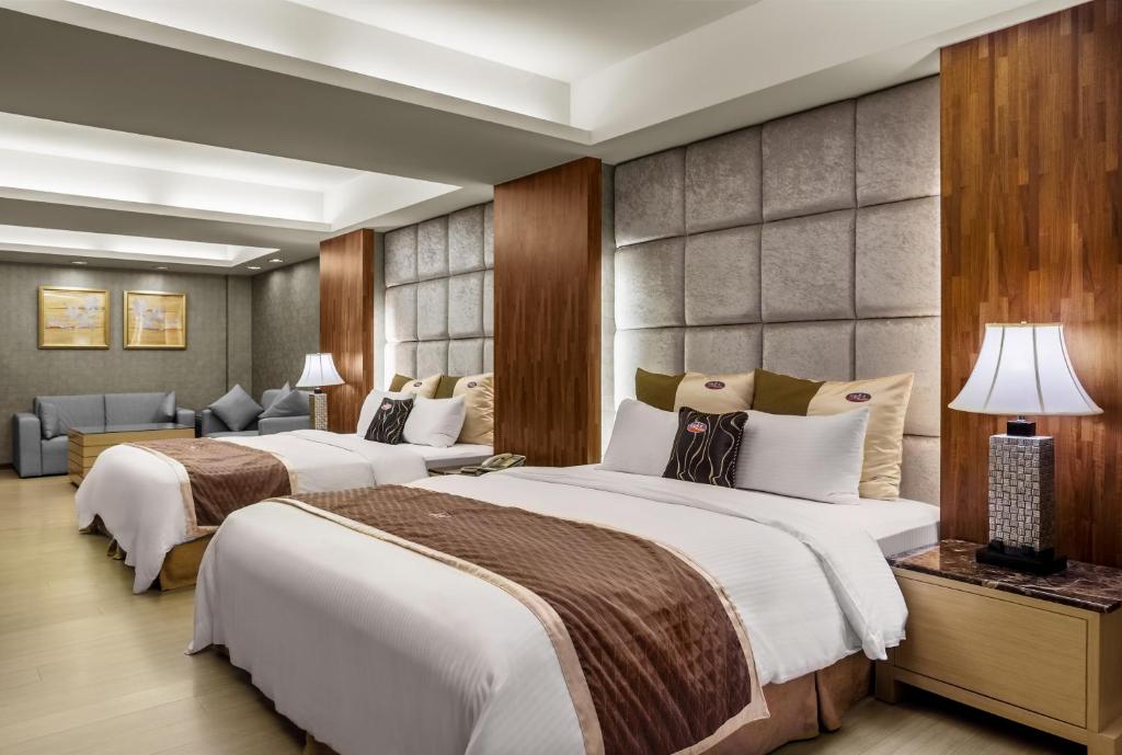 Postel nebo postele na pokoji v ubytování Chuang-Tang Spring SPA Hotel - Deyang