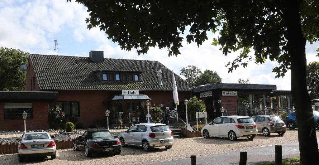 a group of cars parked in front of a building at Hotel Haus Schüppen in Wegberg
