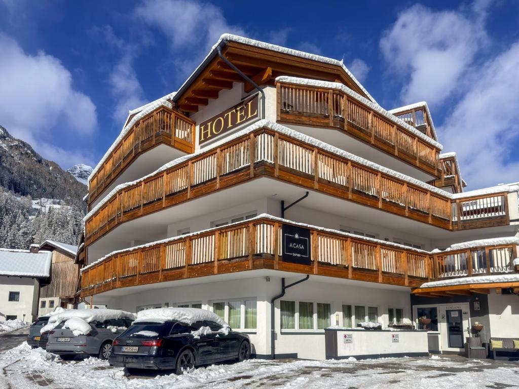 a hotel with cars parked in front of it at A Casa Saphir Appartement-Hotel in Sölden