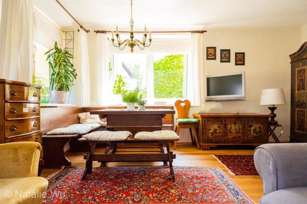 a living room with a table and a couch at Apartment Ischl Home in Bad Ischl